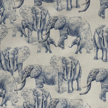 Blue elephant fabric on oatmeal cotton background